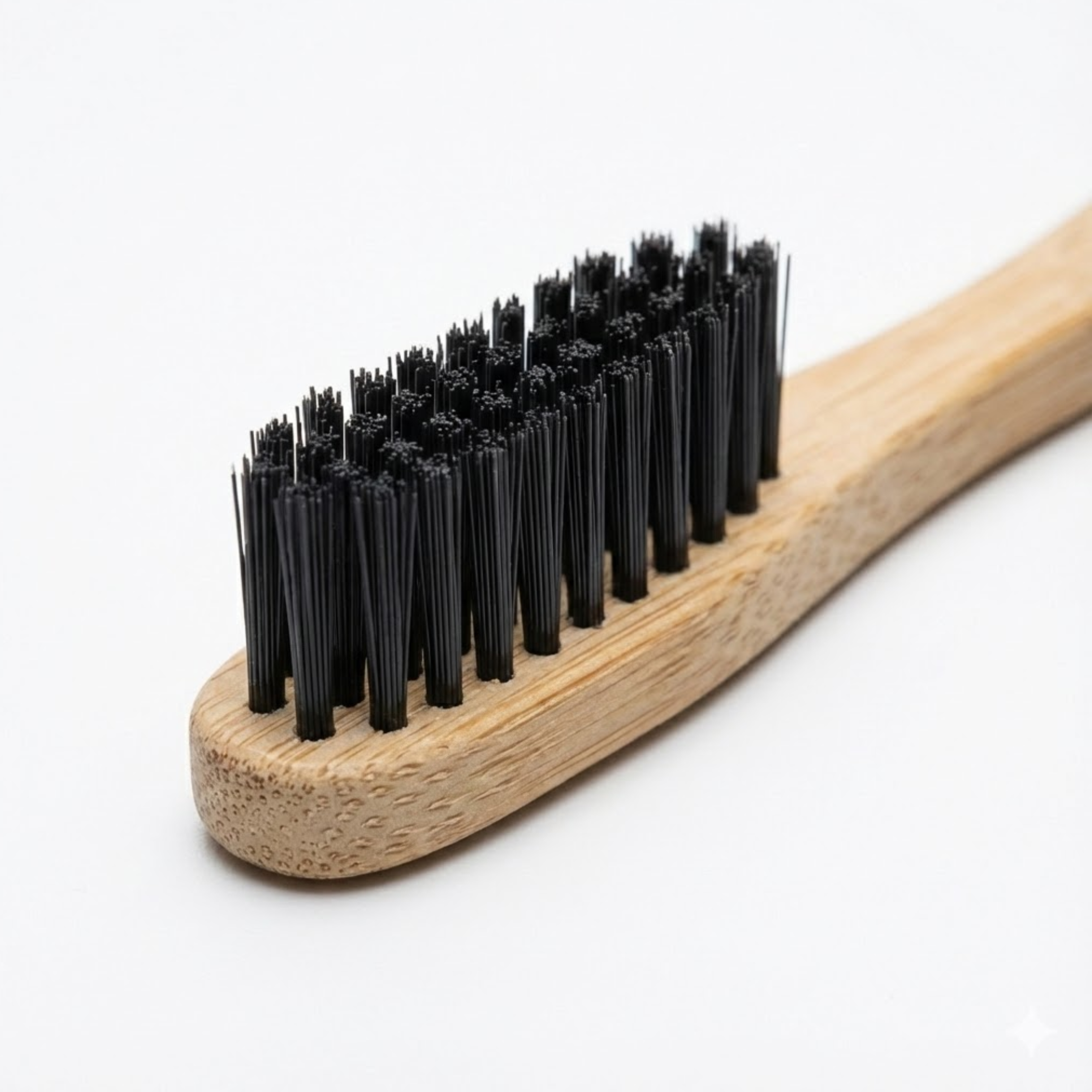 Bamboo brush with black bristles on a white background
